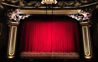 Red curtain at a performance theatre