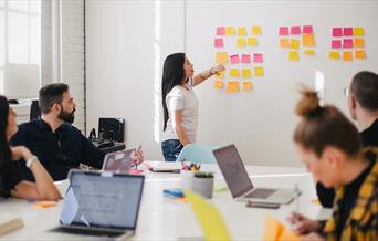 Woman leading a group meeting