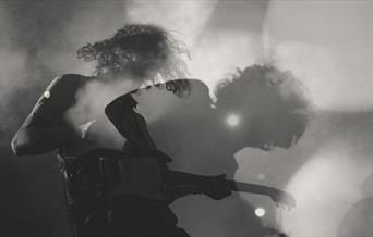 Man playing a guitar