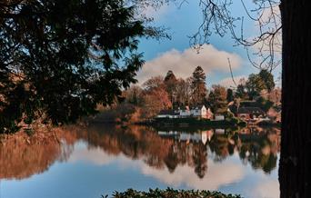 a view of the Lake House across the lake to the accommodation - a quiet secluded atmosphere