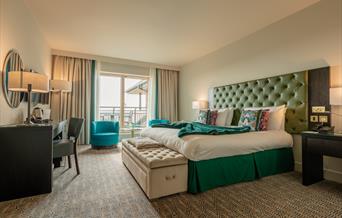 spacial double bedroom with doors to balcony