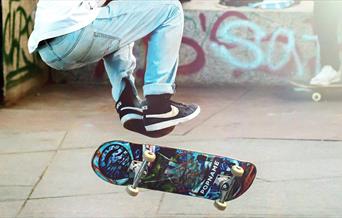 Person doing a skateboard trick