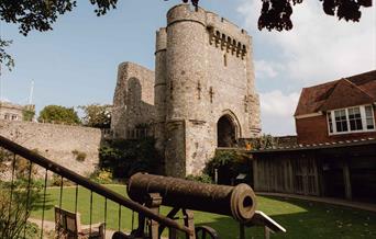 Lewes Castle exterior showing tower and old cannon in foreground