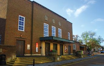 External shot of Assembly hall venue in Worthing, a brick building with large windows