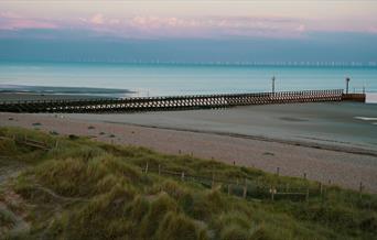 sea with the tide out taken from sand dunes on Littlehampton west beach