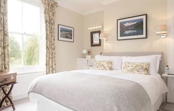 bedroom with double bed and large window