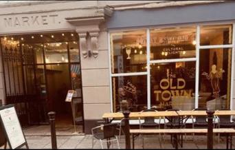 out side seating and view of the entrance of the old town market