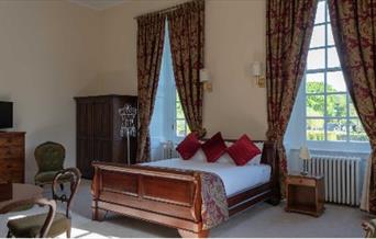 castle room with big windows and period furniture