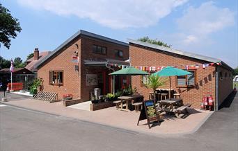 main campsite building with outside seating