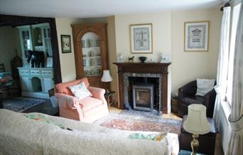inside the lounge with comfortable seating in a cottage style