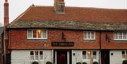 Swan Inn, fittleworth pub building with red tile roof and chimney
