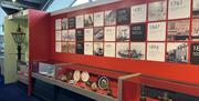 A timeline made of black and white square boards set against a red background