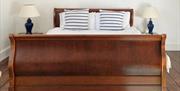 Solid wood bed at Charters B&B