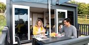 Couple Enjoying lunch outside Glamping Pod