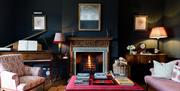 Living room with fire and piano