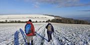 walkers on the south downs way on an frosty morning