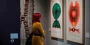 person looking at art exhibition