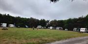 field with camper vans around the edges