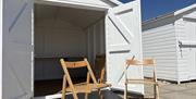 The front of one of our beach huts, looking inside the double doors and facilities inside.