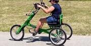 A person using a hand propelled bike