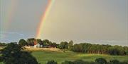 Rainbow over a countryside field