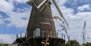 the windmill with blue skies