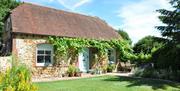 A sunny day view of the outside of a Sussex holiday cottage (1)