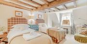 Cosy twin bedroom with low beams