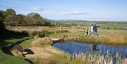 Couple enjoying Pulbourough brooks landscape on a bright sunny day