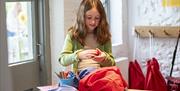 young person doing crafts