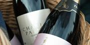 bottles of charles palmer wine in a wicker basket