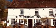 Outside of the Bridge Inn with terrace in sunshine