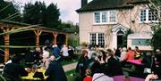 The Gun Inn outdoor seating area full of customers