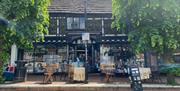 outside the bookshop showing tables and chairs for the cafe