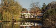 a view across the lake of the accommodation