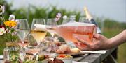 pouring of rose wine