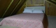 Double bed in a hut