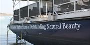 picture of the side of the boat showing seating on the deck