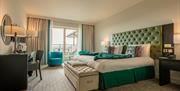 spacial double bedroom with doors to balcony