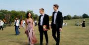 well dressed guests on the green at Glyndebourne opera house