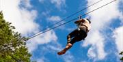 Woman on zipline at Go Ape Crawley