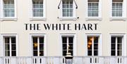Exterior of the white hart hotel, a white painted 16th century coaching inn in Lewes