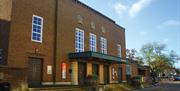 External shot of Assembly hall venue in Worthing, a brick building with large windows