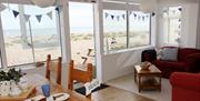 Seaspray Pagham dining/sunroom with amazing sea view