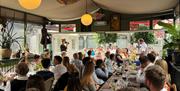 people at a long dining table