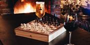 Board games by an open fire