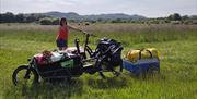 bicycle with storage front and a towable trailer