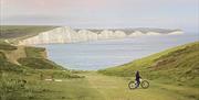 distant view of Seven Sisters and a lone cyclist