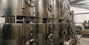 Wine fermenting tanks in winery