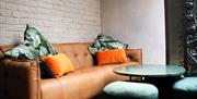Plush Sofa, Orange Cushions